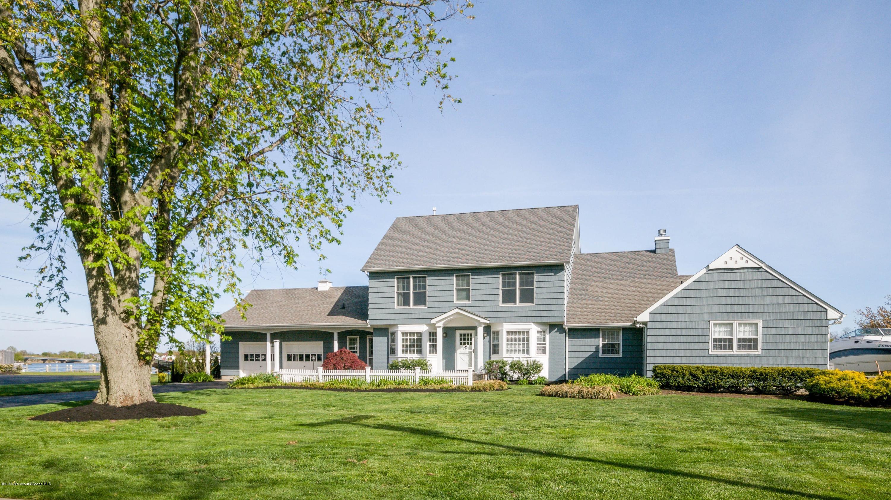 68 Rivers Edge Drive Little Silver, NJ 07739 - Photo 2 of 25 front view of a house with a yard