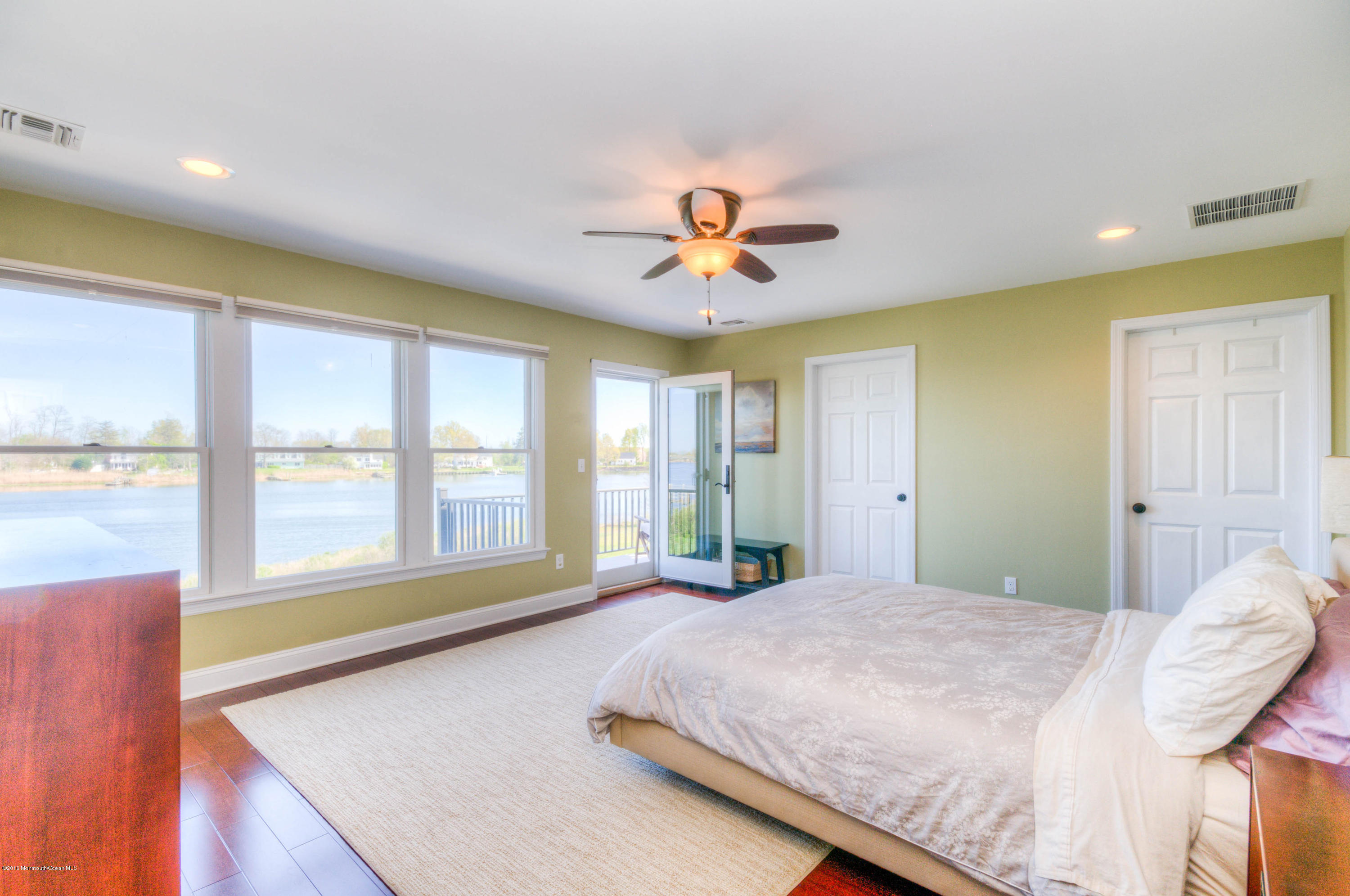 68 Rivers Edge Drive Little Silver, NJ 07739 - Photo 12 of 25 a bedroom with a large bed and a large window