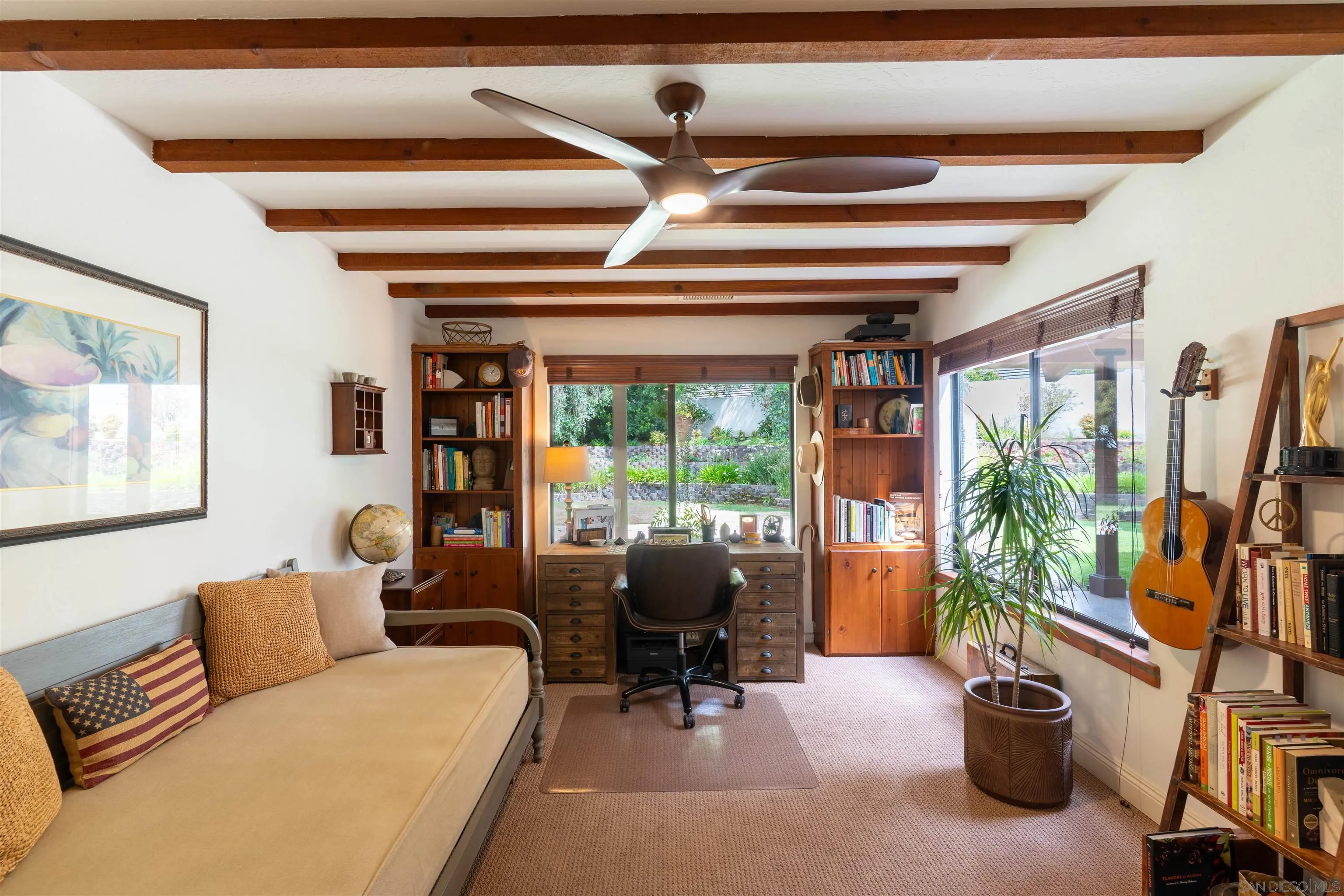 1036 Capra Way Fallbrook, CA 92028 - Photo 15 of 51 a living room with furniture a flat screen tv and a large window