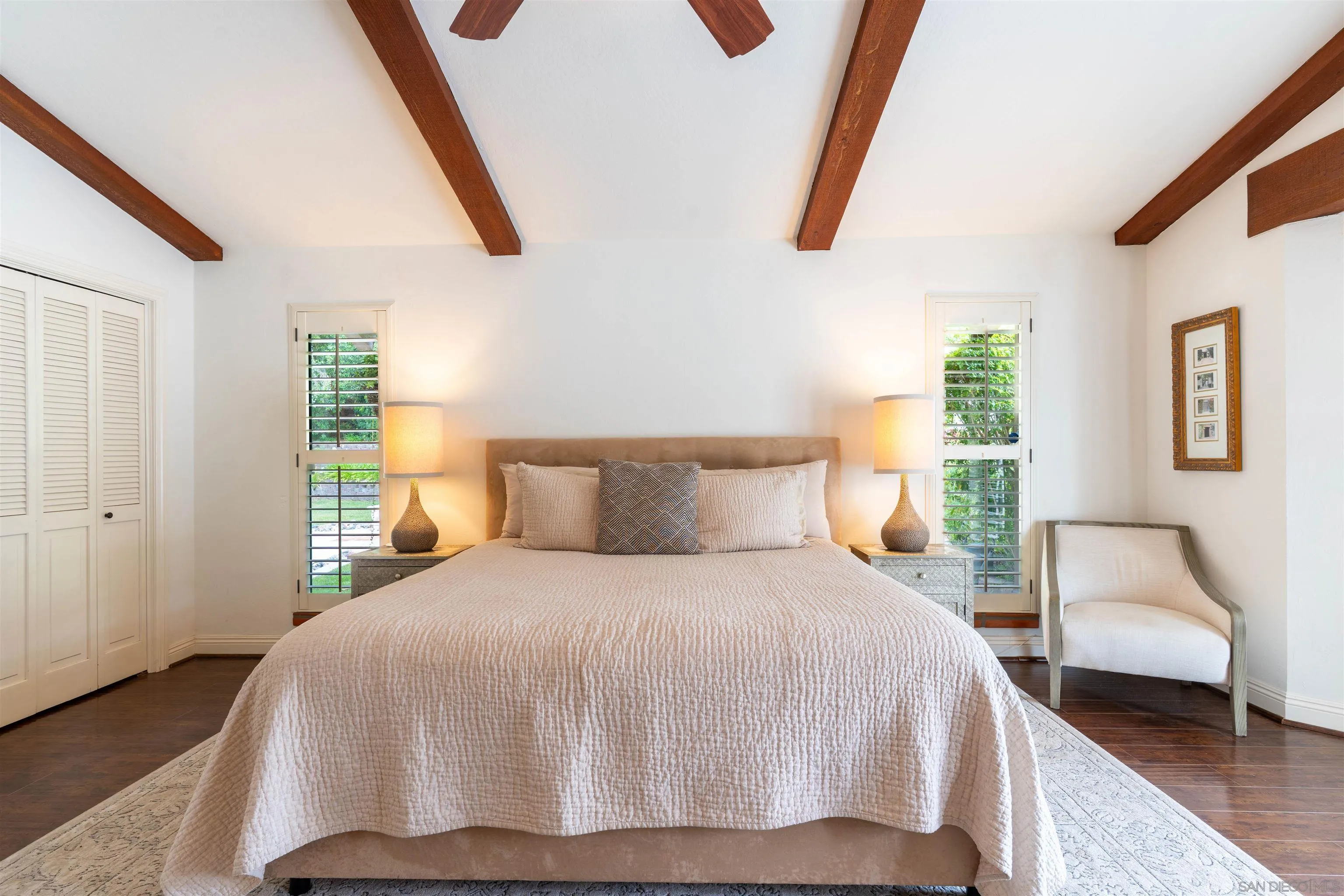 1036 Capra Way Fallbrook, CA 92028 - Photo 18 of 51 a bedroom with a large bed and a couch