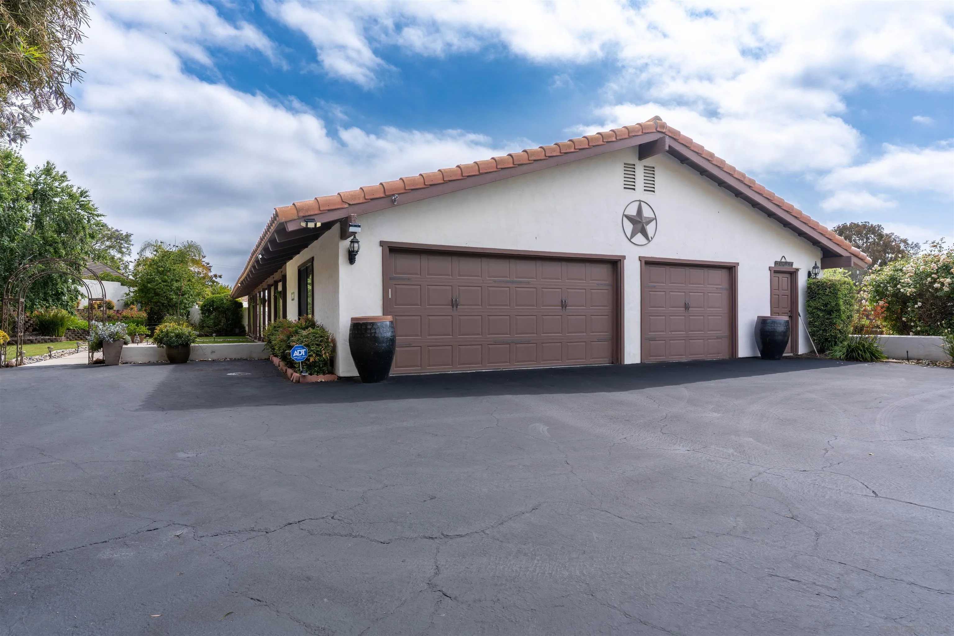 1036 Capra Way Fallbrook, CA 92028 - Photo 37 of 51 a view of a house with a yard and garage