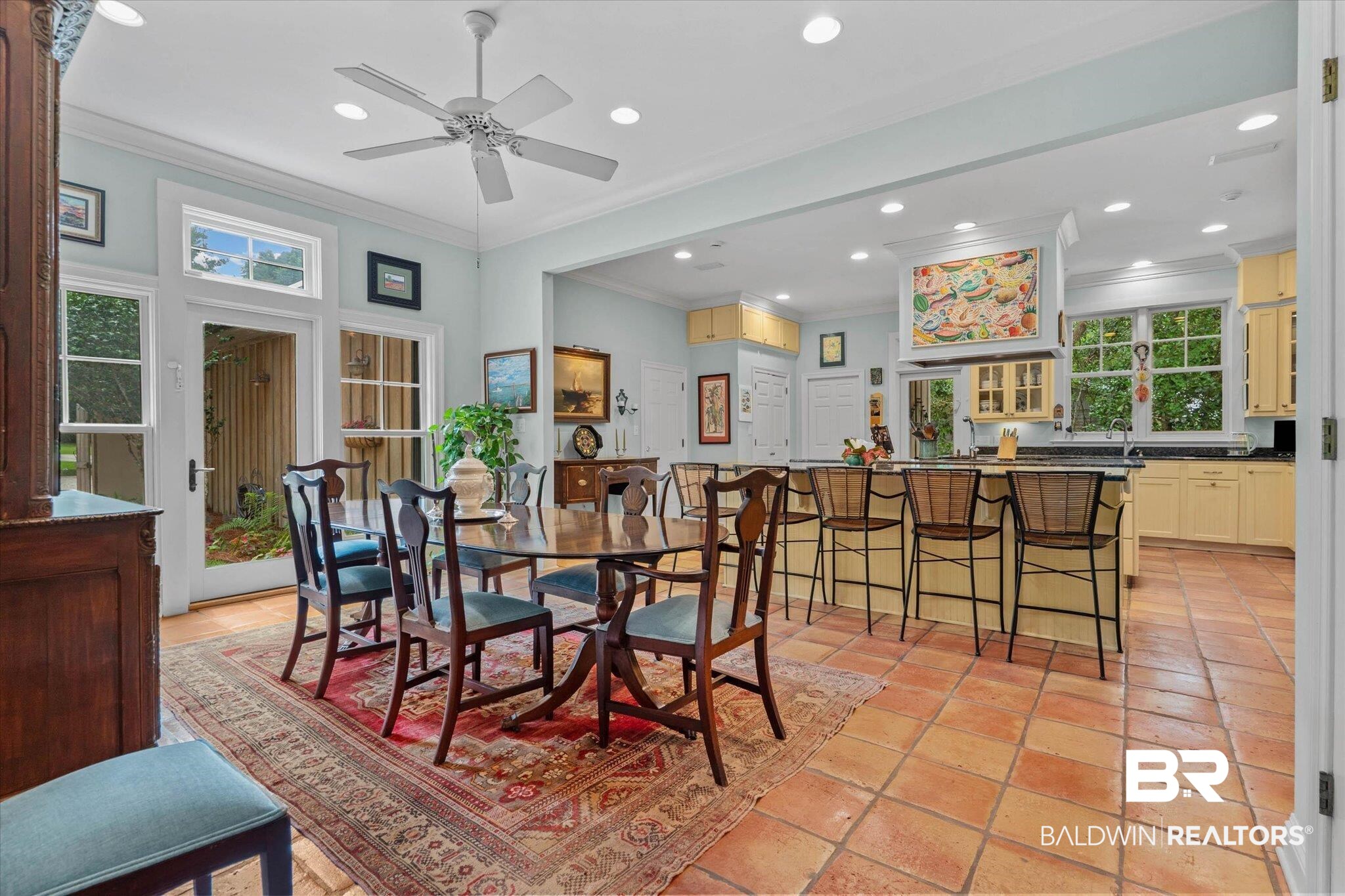 8841 Escambia Avenue Elberta, AL 36530 - Photo 9 of 66 Featuring the open plan and the large granite breakfast bar and kitchen.