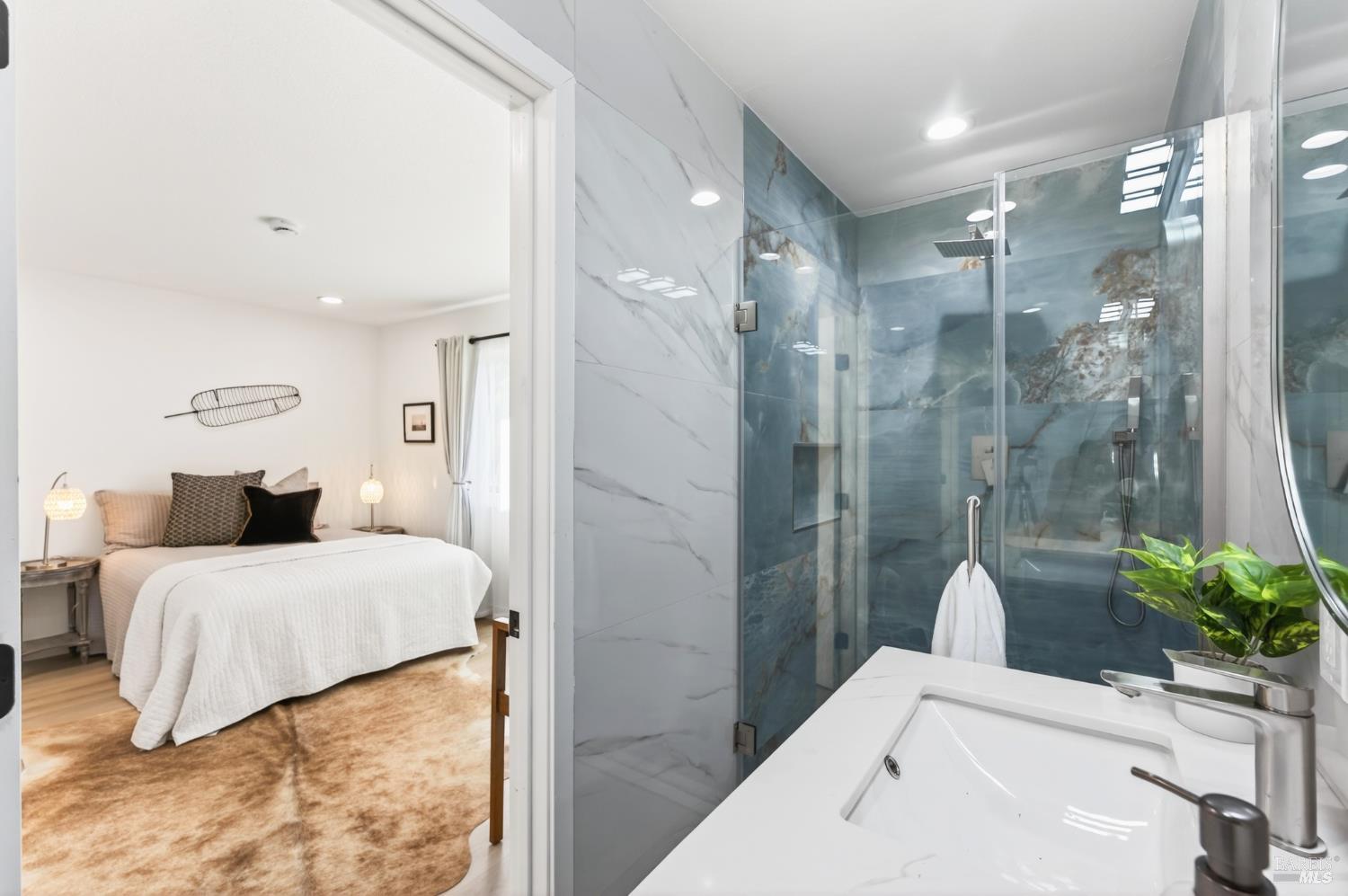 2447 Rigdon Street Napa, CA 94558 - Photo 59 of 79 a bathroom with a tub sink and glass door