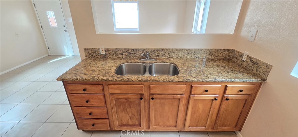 1060 Cherry, Unit A & B Long Beach, CA 90813 - Photo 37 of 63 a kitchen with granite countertop a sink and cabinets