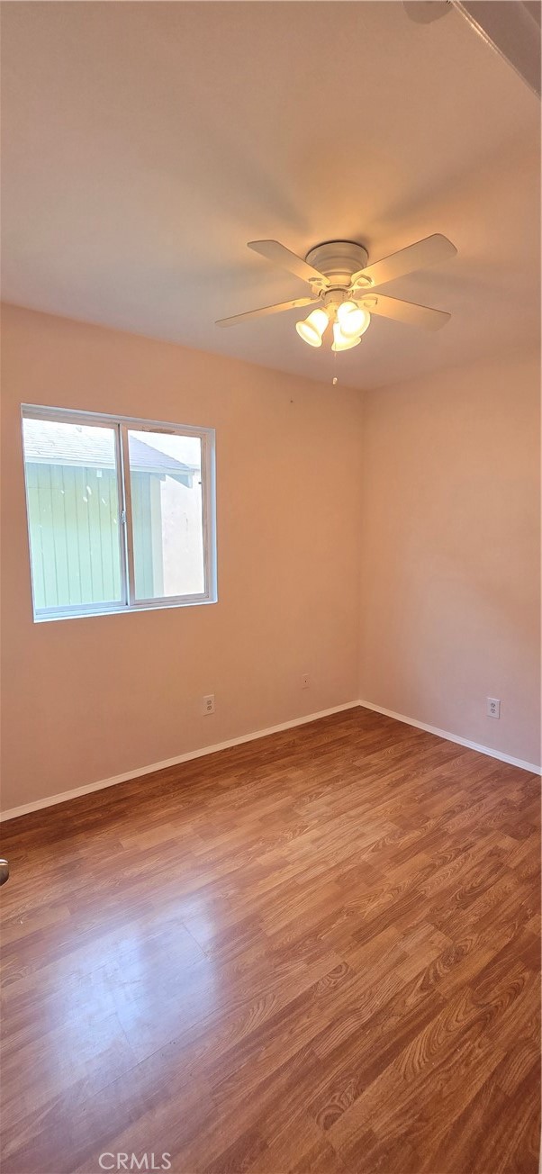 1060 Cherry, Unit A & B Long Beach, CA 90813 - Photo 39 of 63 a view of empty room with wooden floor and fan