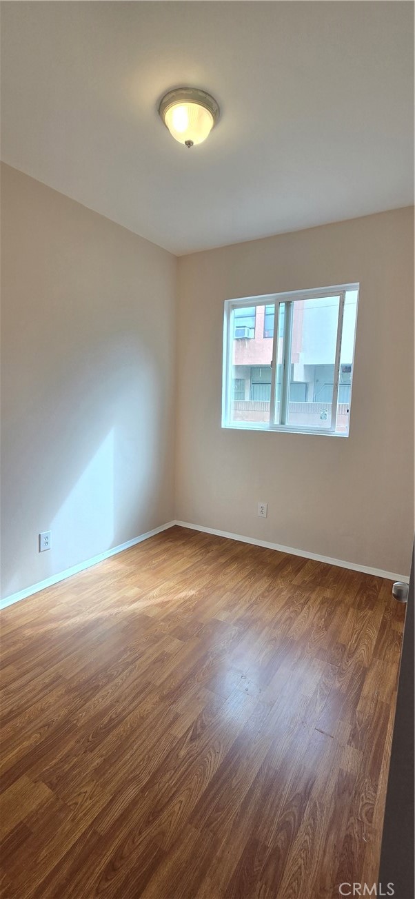 1060 Cherry, Unit A & B Long Beach, CA 90813 - Photo 48 of 63 a view of an empty room with wooden floor and a window
