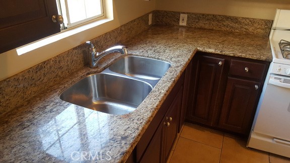 1060 Cherry, Unit A & B Long Beach, CA 90813 - Photo 6 of 63 a kitchen with granite countertop a sink and granite top