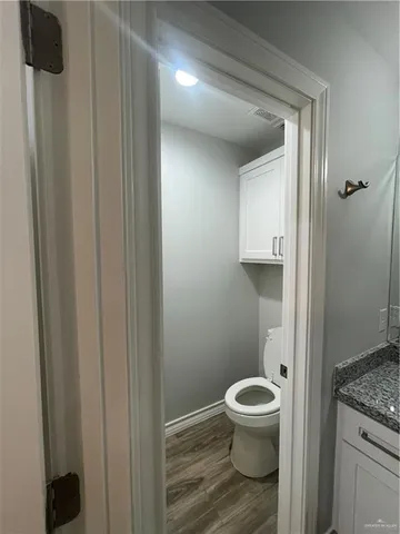 a bathroom with a toilet and a sink