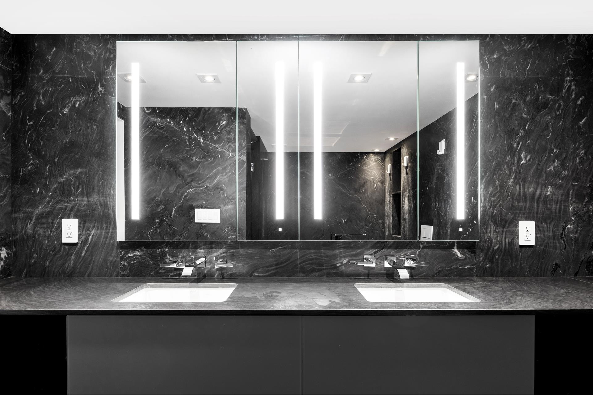 135 West 70th Street, Unit 10C Manhattan, NY 10023 - Photo 10 of 24 a bathroom with a double vanity sink and a mirror