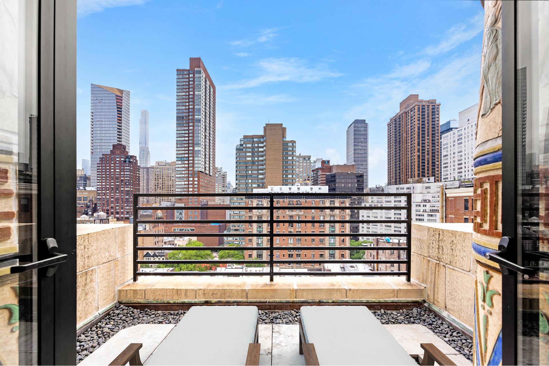 135 West 70th Street, Unit 10C Manhattan, NY 10023 - Photo 2 of 24 a view of a city with tall buildings