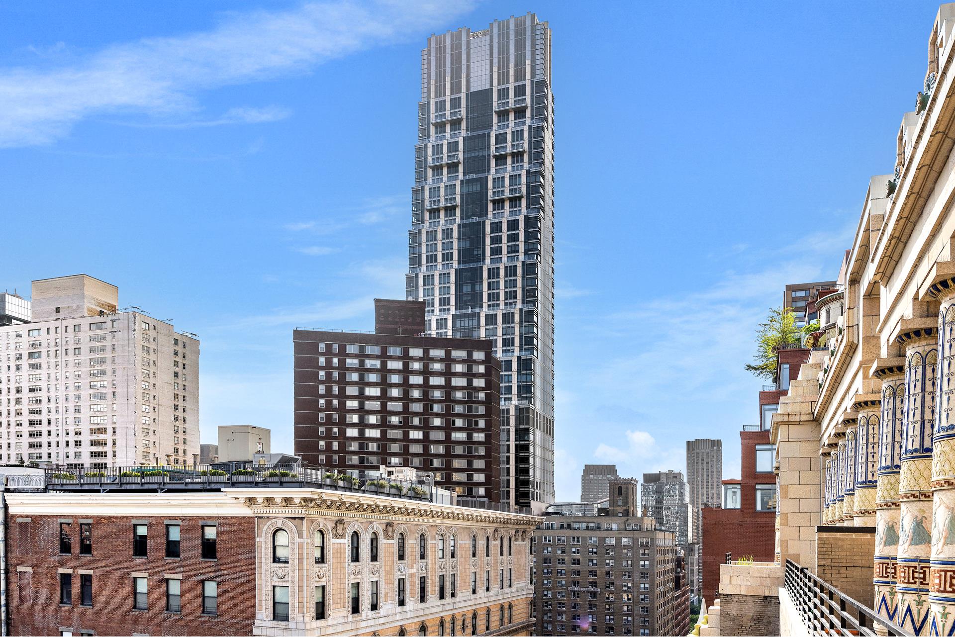 135 West 70th Street, Unit 10C Manhattan, NY 10023 - Photo 23 of 24 a view of a city with tall buildings
