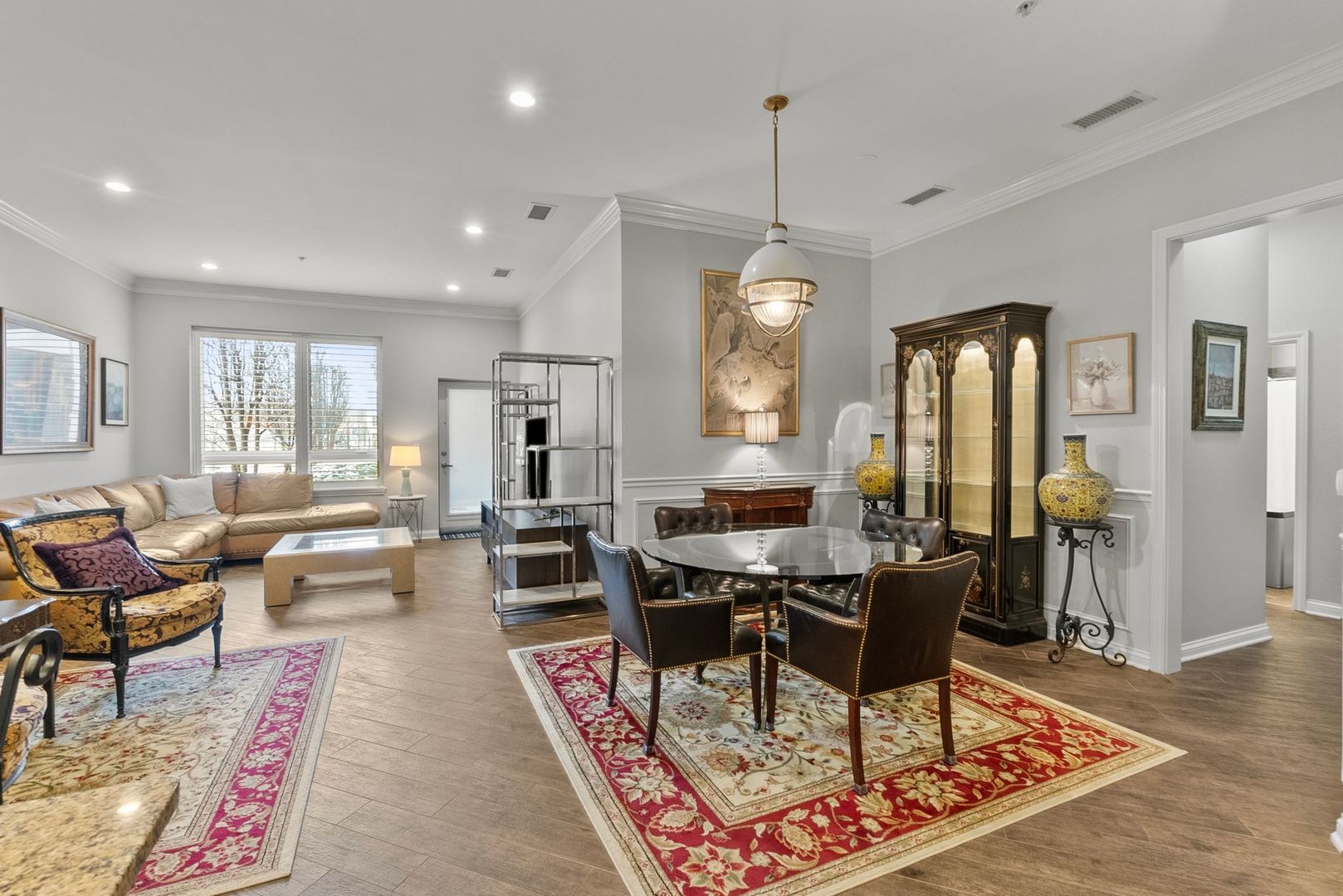 1000 Village Center Drive, Unit 102 Burr Ridge, IL 60527 - Photo 11 of 28 a living room with furniture and a chandelier