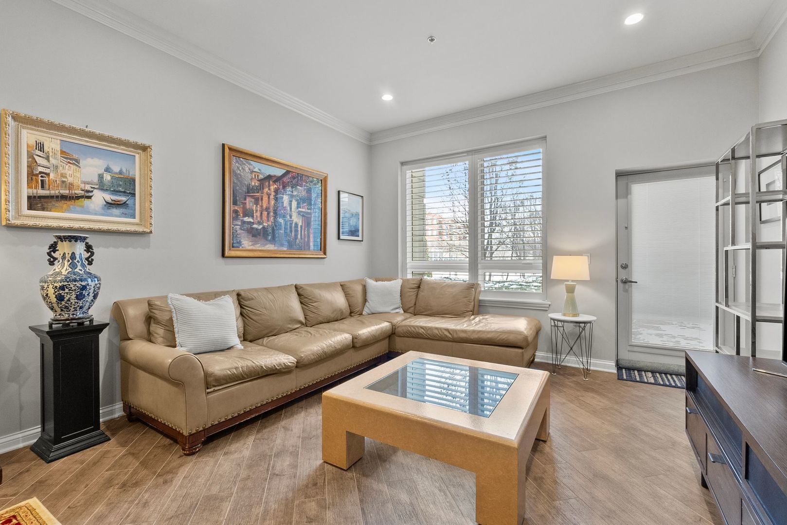 1000 Village Center Drive, Unit 102 Burr Ridge, IL 60527 - Photo 13 of 28 a living room with furniture and a couch