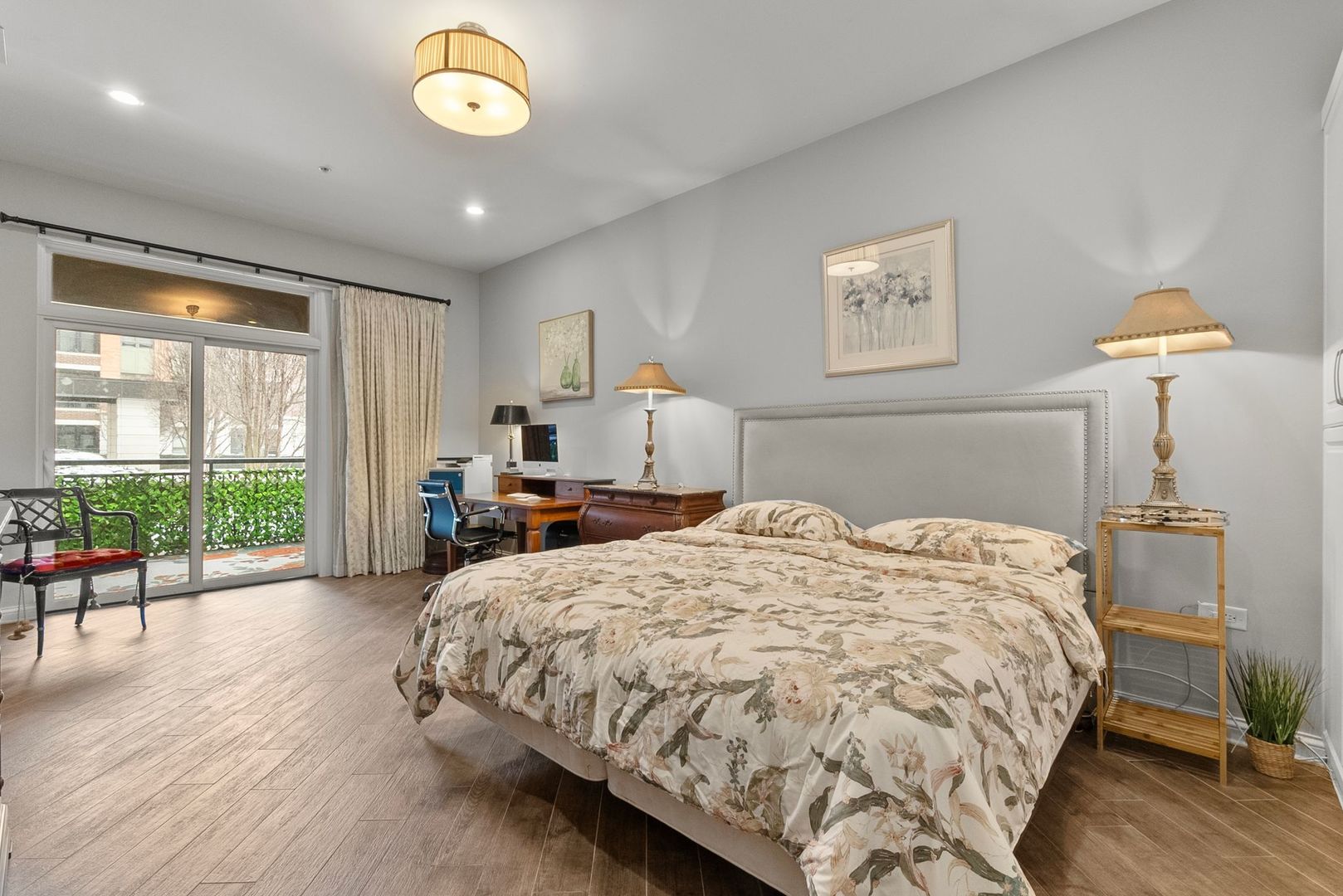 1000 Village Center Drive, Unit 102 Burr Ridge, IL 60527 - Photo 17 of 28 a bed sitting in a spacious bedroom next to a window