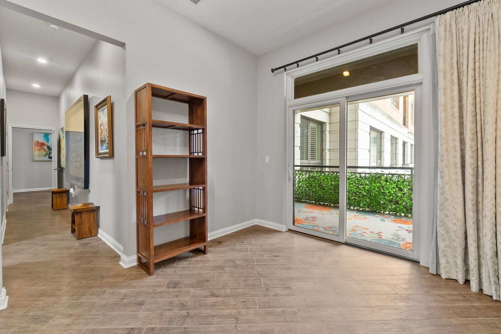1000 Village Center Drive, Unit 102 Burr Ridge, IL 60527 - Photo 19 of 28 a view of an empty room with floor to ceiling window