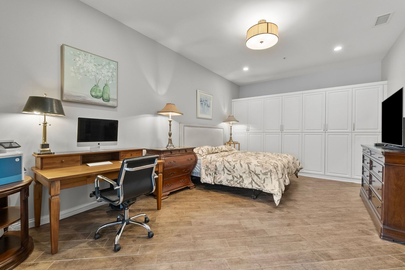 1000 Village Center Drive, Unit 102 Burr Ridge, IL 60527 - Photo 20 of 28 a bedroom with a bed and a desk