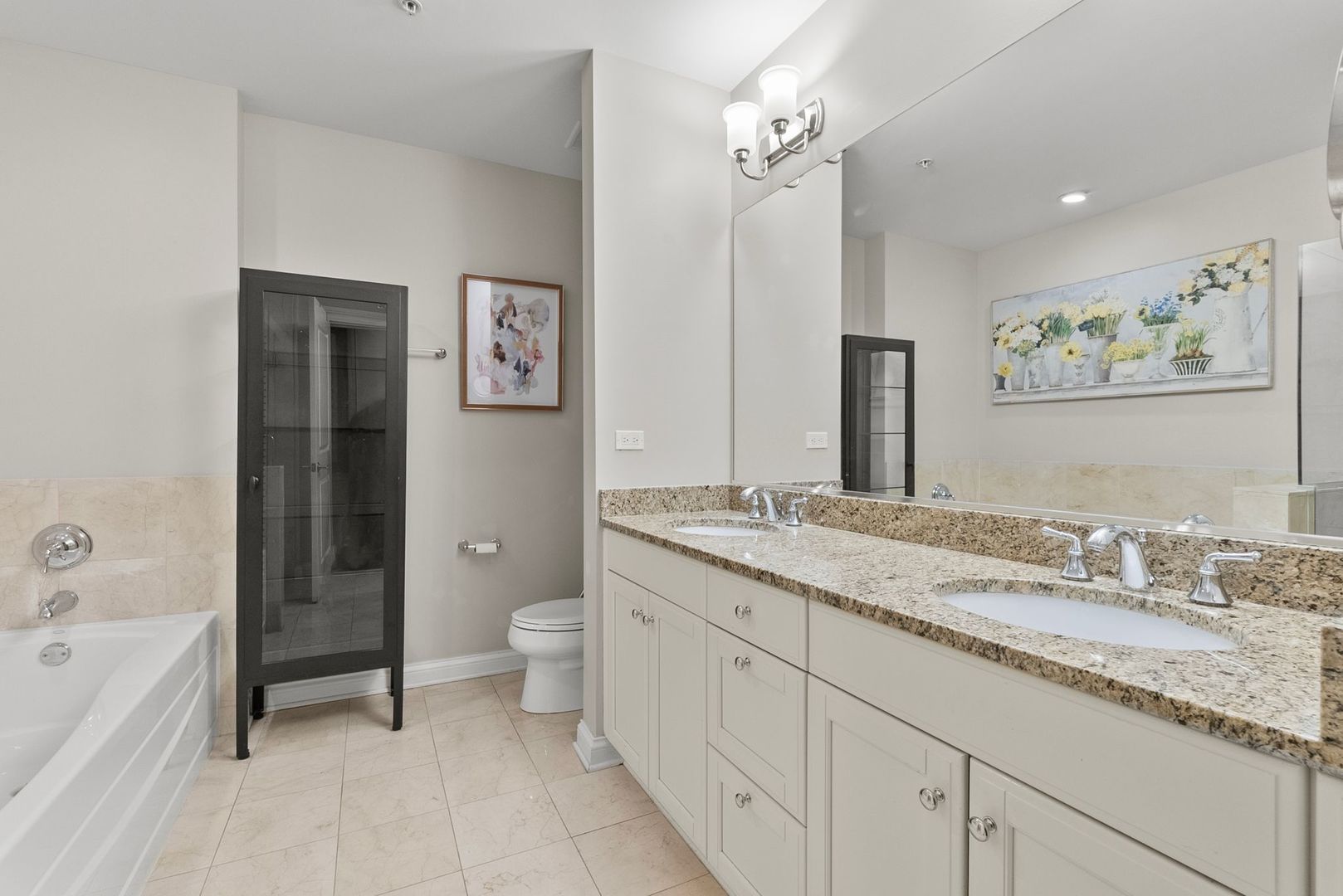 1000 Village Center Drive, Unit 102 Burr Ridge, IL 60527 - Photo 22 of 28 a spacious bathroom with a granite countertop sink toilet and shower