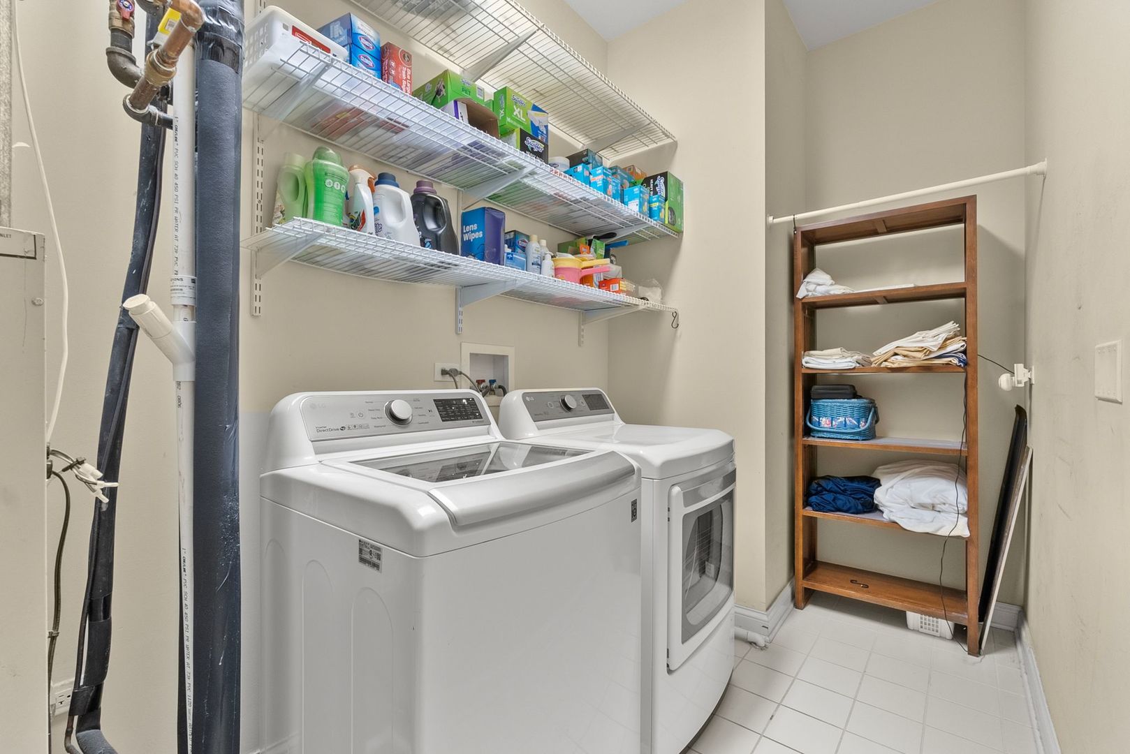 1000 Village Center Drive, Unit 102 Burr Ridge, IL 60527 - Photo 27 of 28 a utility room with dryer and washer