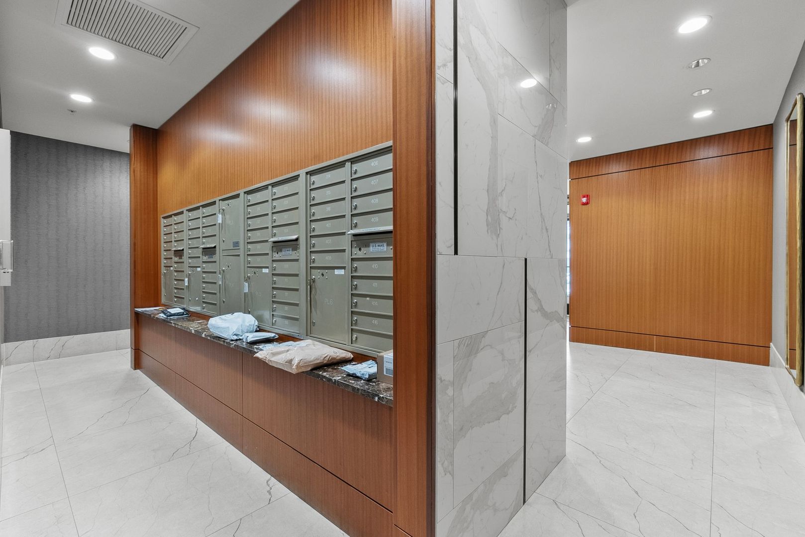 1000 Village Center Drive, Unit 102 Burr Ridge, IL 60527 - Photo 28 of 28 a hallway with kids couch