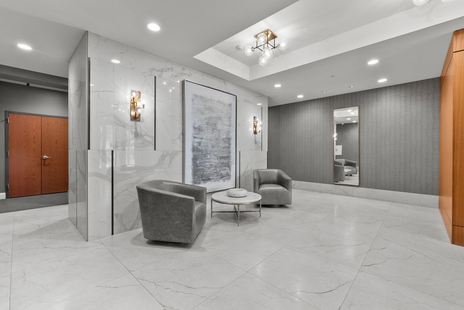 1000 Village Center Drive, Unit 102 Burr Ridge, IL 60527 - Photo 3 of 28 a large room with a mirror and furniture