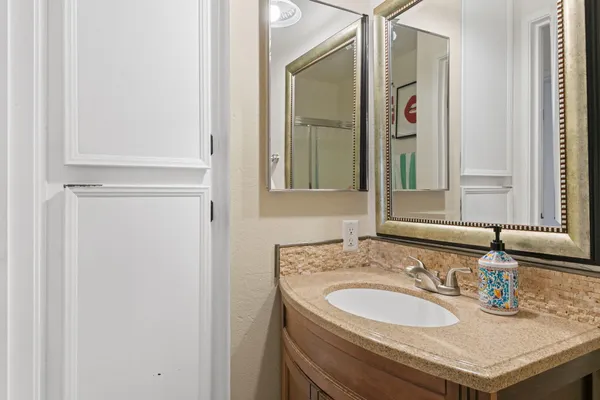 a bathroom with a sink and a mirror