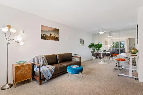 a living room with furniture and a table
