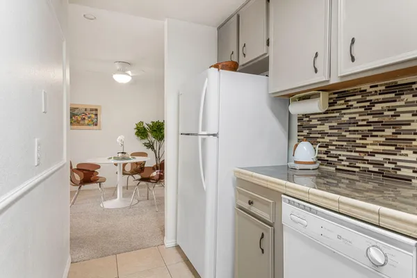 a kitchen with appliances and cabinets
