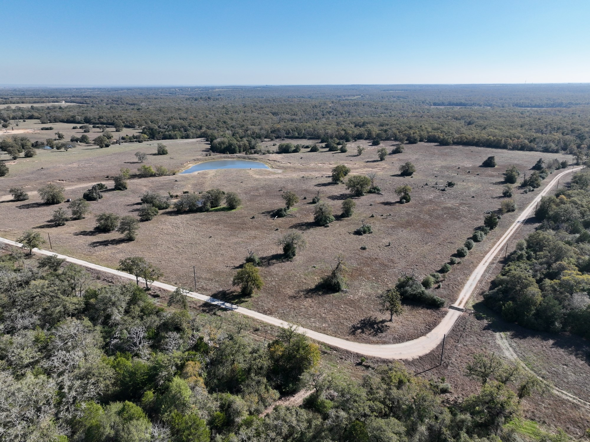 848 County Road 359 Gause, TX 77857 - Photo 40 of 50 an aerial view of a house with a yard and ocean view