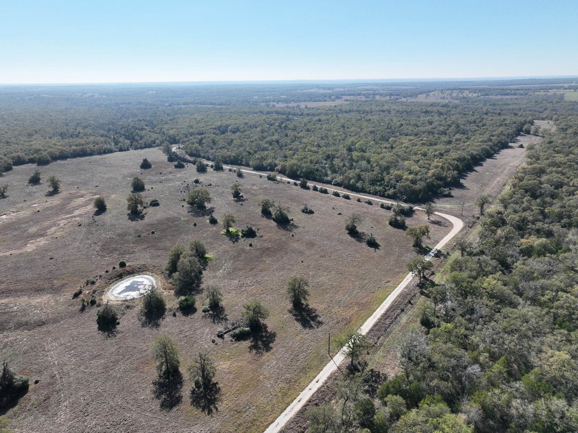 848 County Road 359 Gause, TX 77857 - Photo 43 of 50 an aerial view of grey house with outdoor space