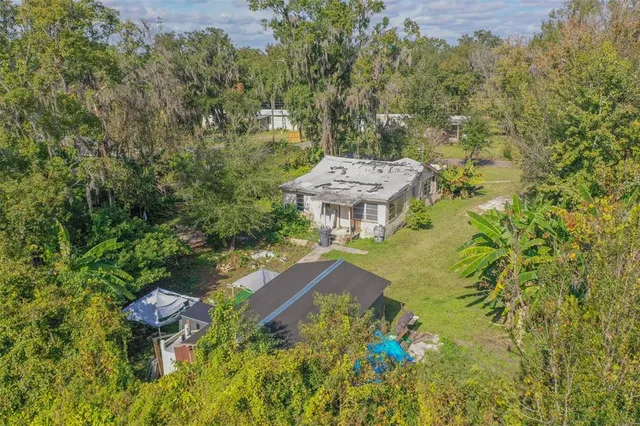 an aerial view of residential houses with outdoor space