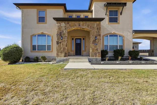a workspace with a couch and a window