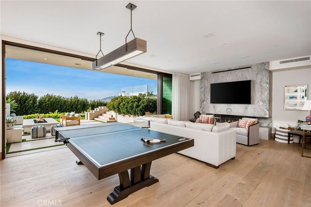 a view of a livingroom with furniture and flat screen tv