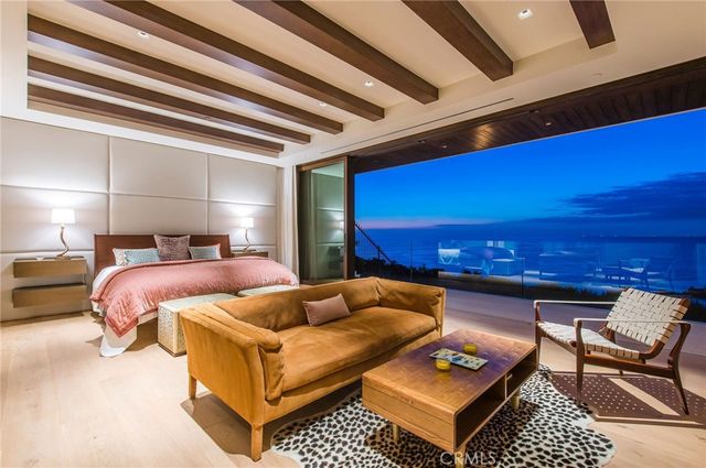 a balcony with furniture and a fireplace