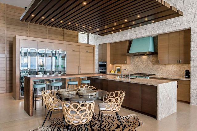 a kitchen with a table and chairs in it