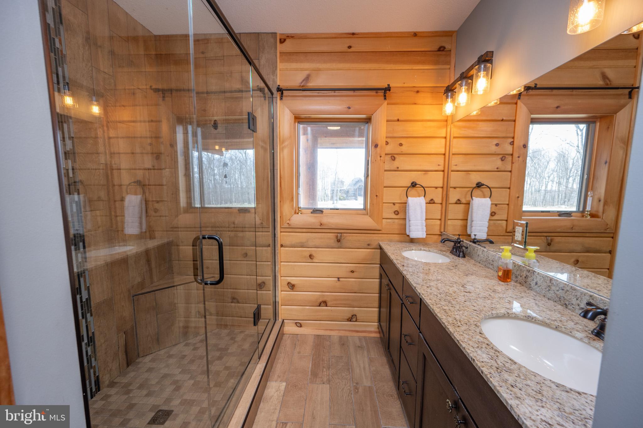 276 Sundance Way McHenry, MD 21541 - Photo 28 of 77 a bathroom with a granite countertop sink mirror and double
