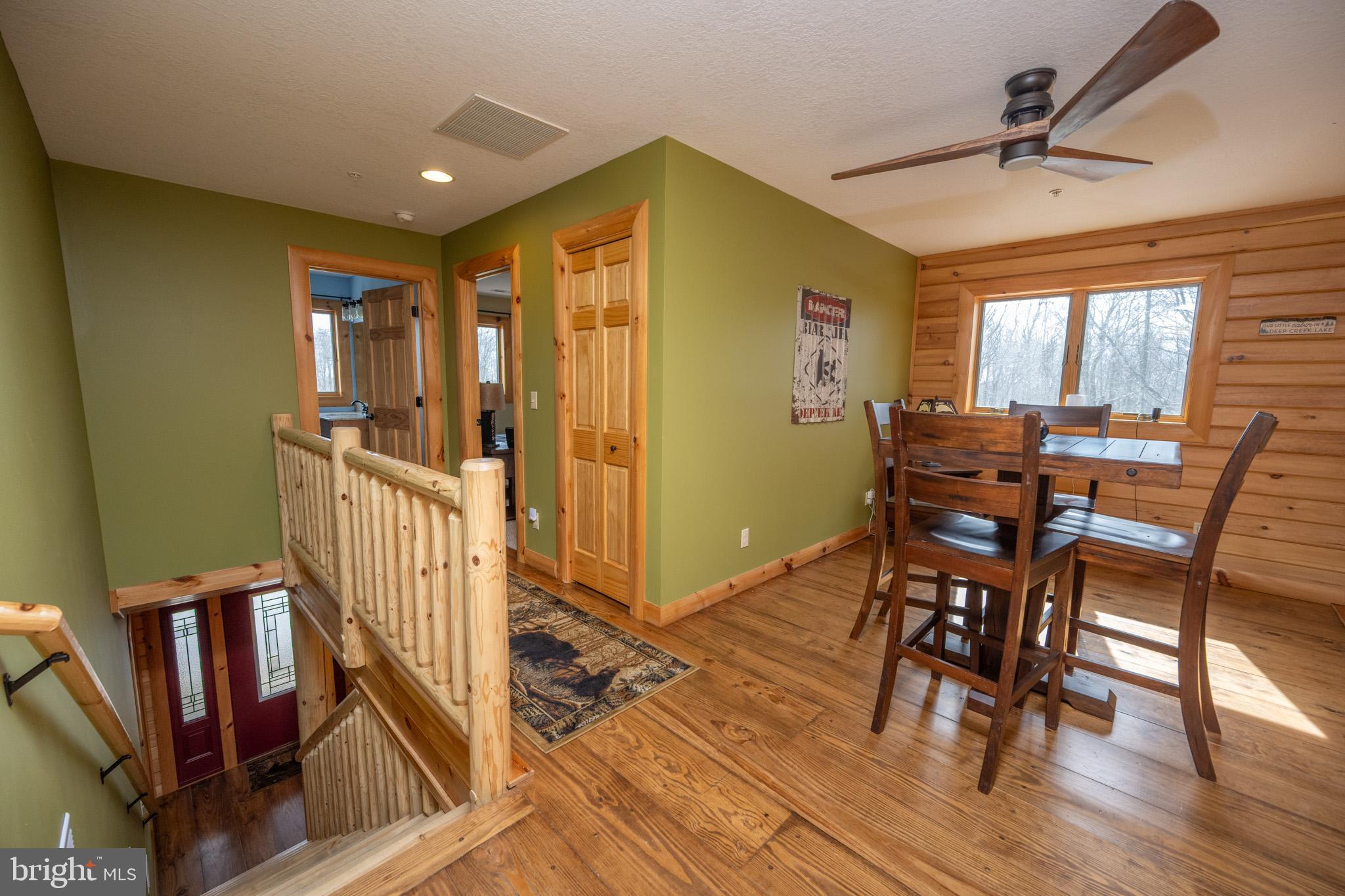 276 Sundance Way McHenry, MD 21541 - Photo 34 of 77 a view of a dining room with furniture and wooden floor