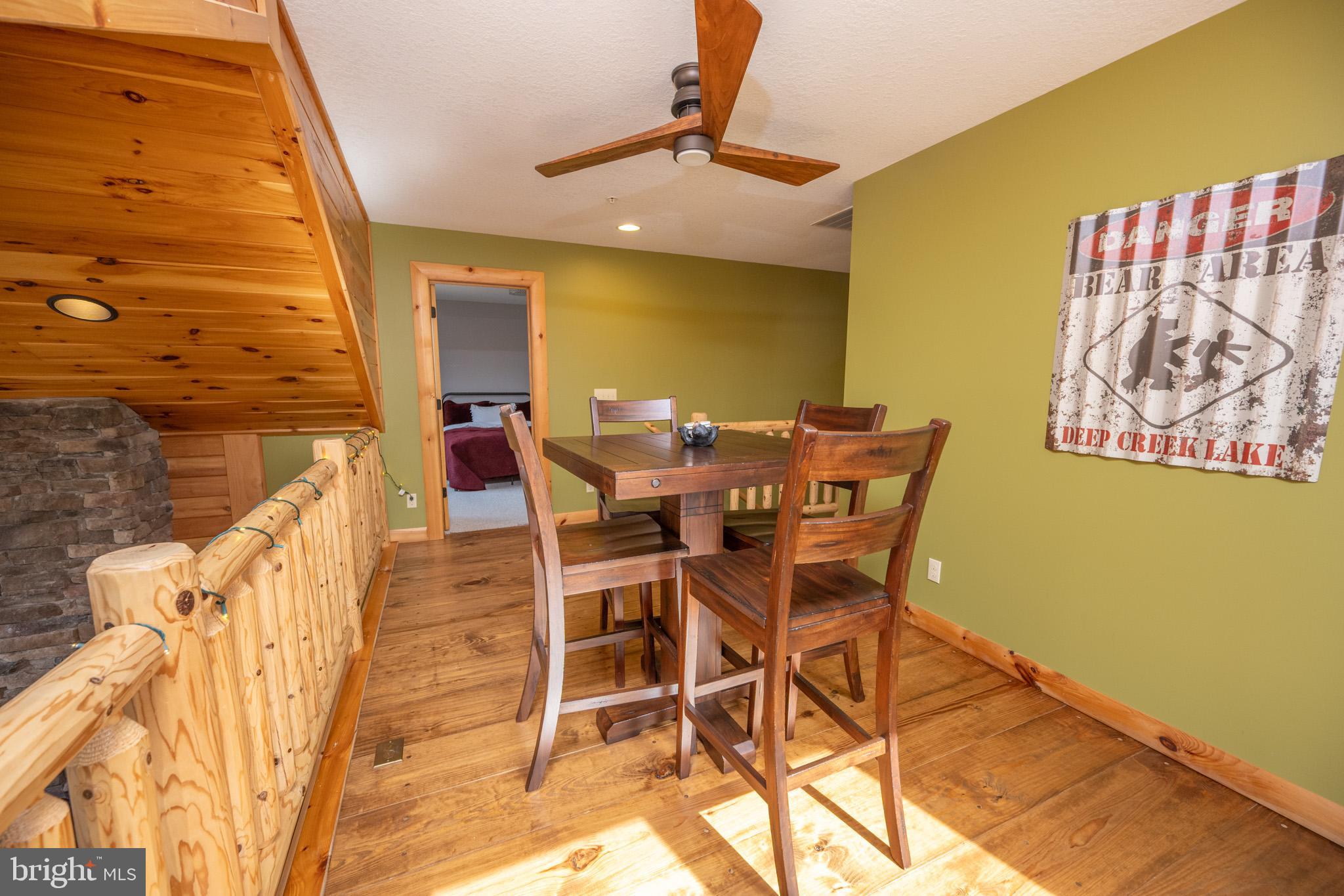 276 Sundance Way McHenry, MD 21541 - Photo 36 of 77 a view of a dining room with furniture and chandelier