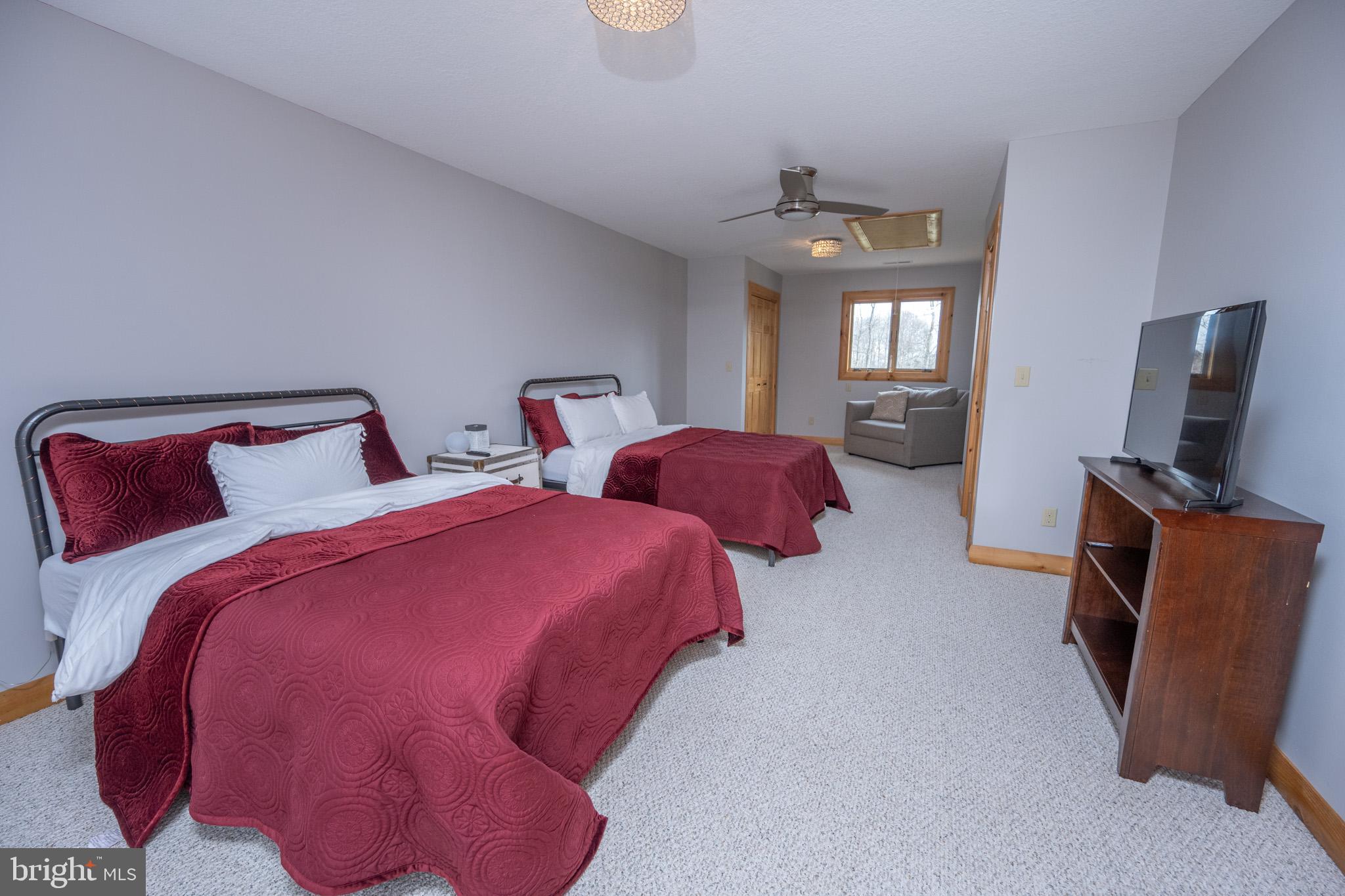 276 Sundance Way McHenry, MD 21541 - Photo 47 of 77 a bedroom with two beds and a tv