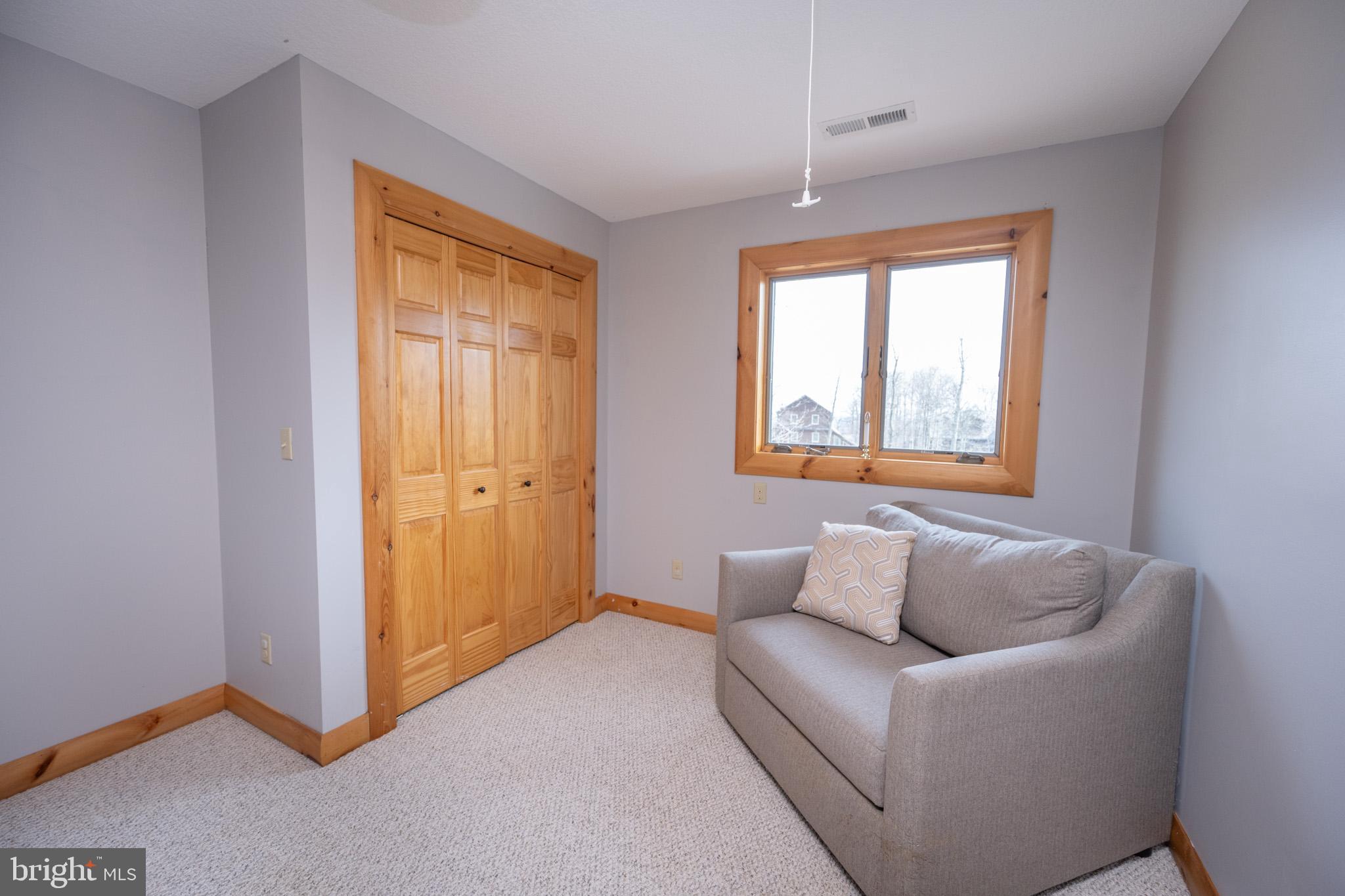 276 Sundance Way McHenry, MD 21541 - Photo 51 of 77 a living room with furniture and a window