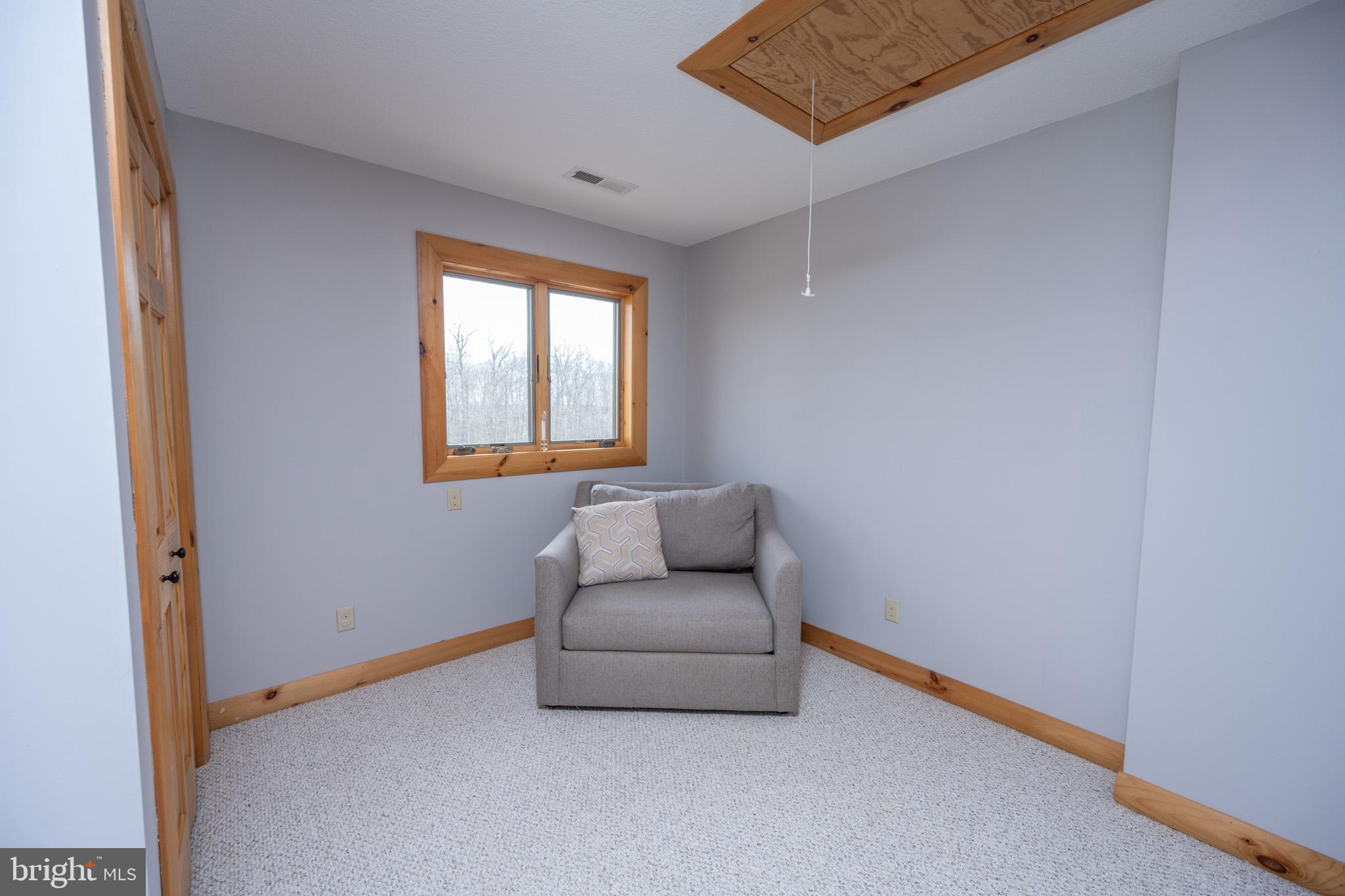 276 Sundance Way McHenry, MD 21541 - Photo 52 of 77 a living room with furniture and a window
