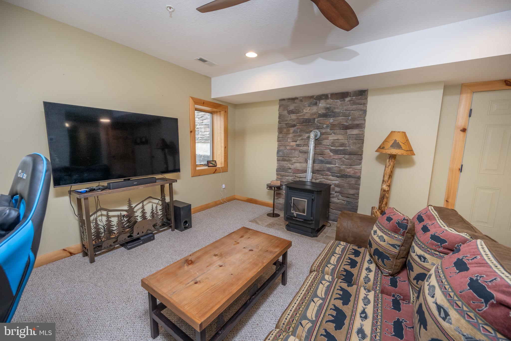 276 Sundance Way McHenry, MD 21541 - Photo 58 of 77 a living room with furniture and a flat screen tv