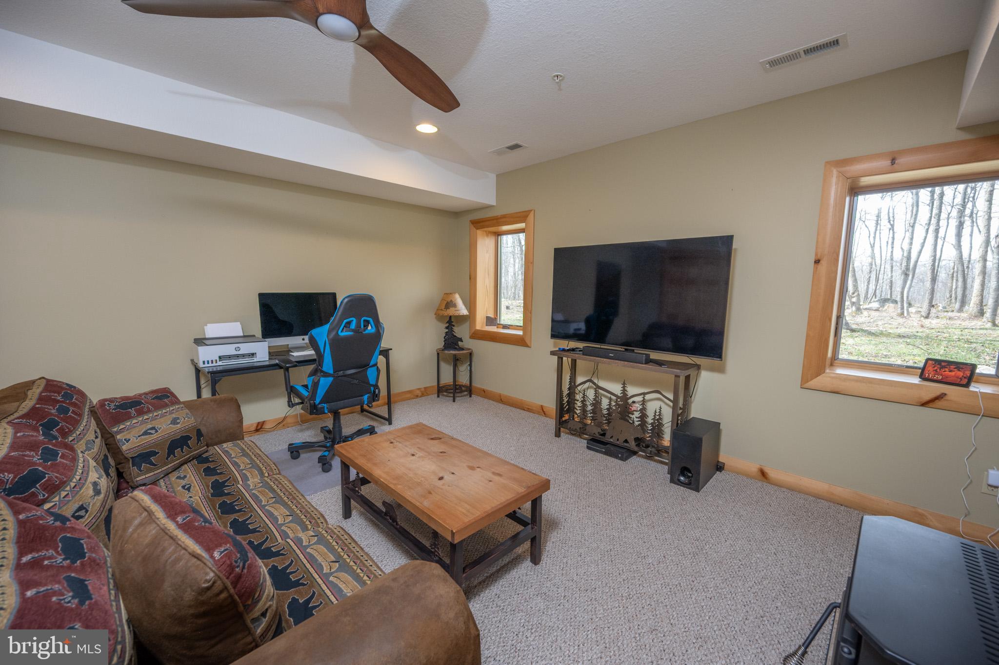 276 Sundance Way McHenry, MD 21541 - Photo 59 of 77 a living room with furniture and a flat screen tv