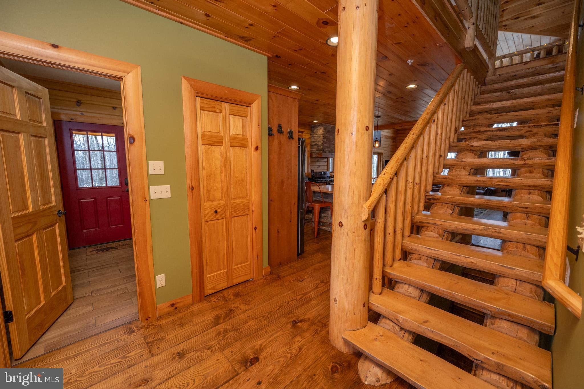276 Sundance Way McHenry, MD 21541 - Photo 8 of 77 a view of entryway with wooden floor and stairs