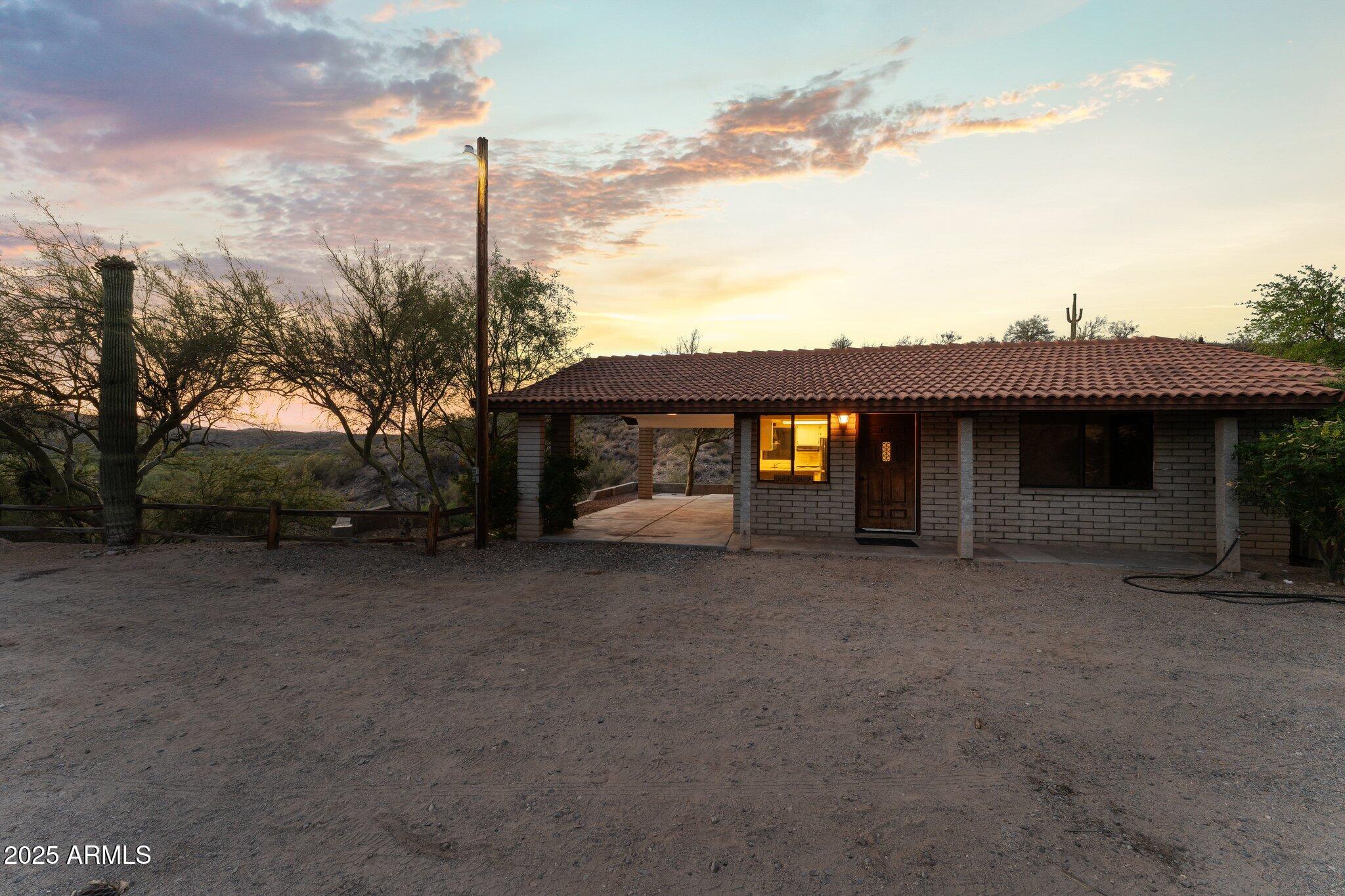 27610 Gill Road Morristown, AZ 85342 - Photo 56 of 71 a view of a house with a backyard and balcony