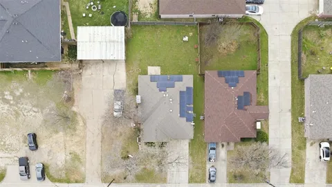 an aerial view of a house with a swimming pool