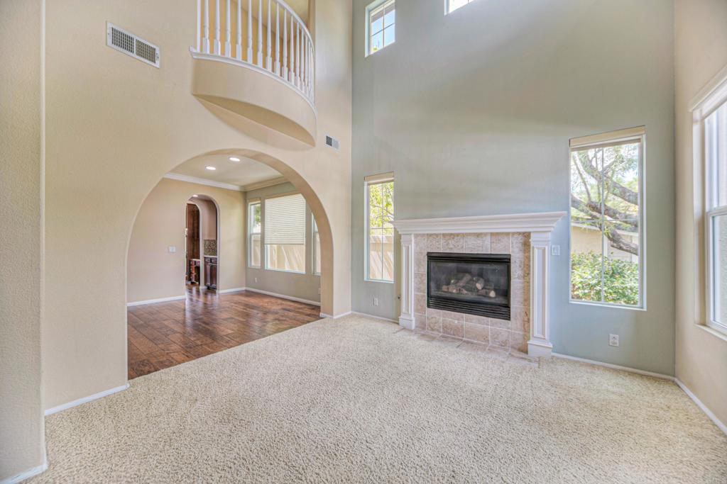 32215 Vía Bejarano Temecula, CA 92592 - Photo 13 of 42 a view of a livingroom with a fireplace and window
