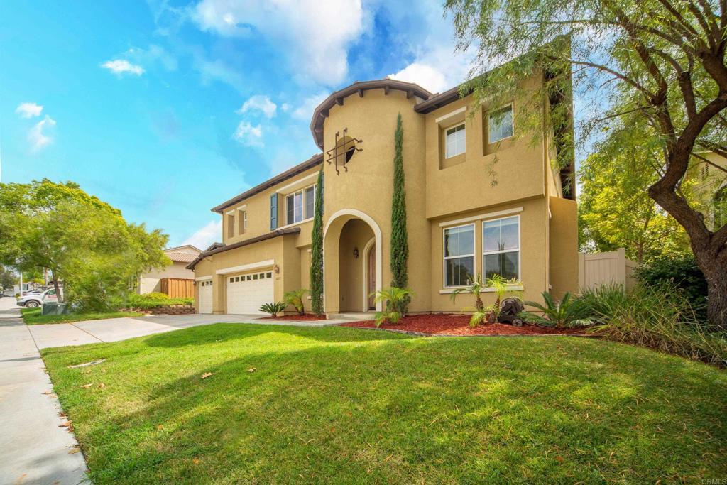 32215 Vía Bejarano Temecula, CA 92592 - Photo 2 of 42 a front view of a house with garden and trees