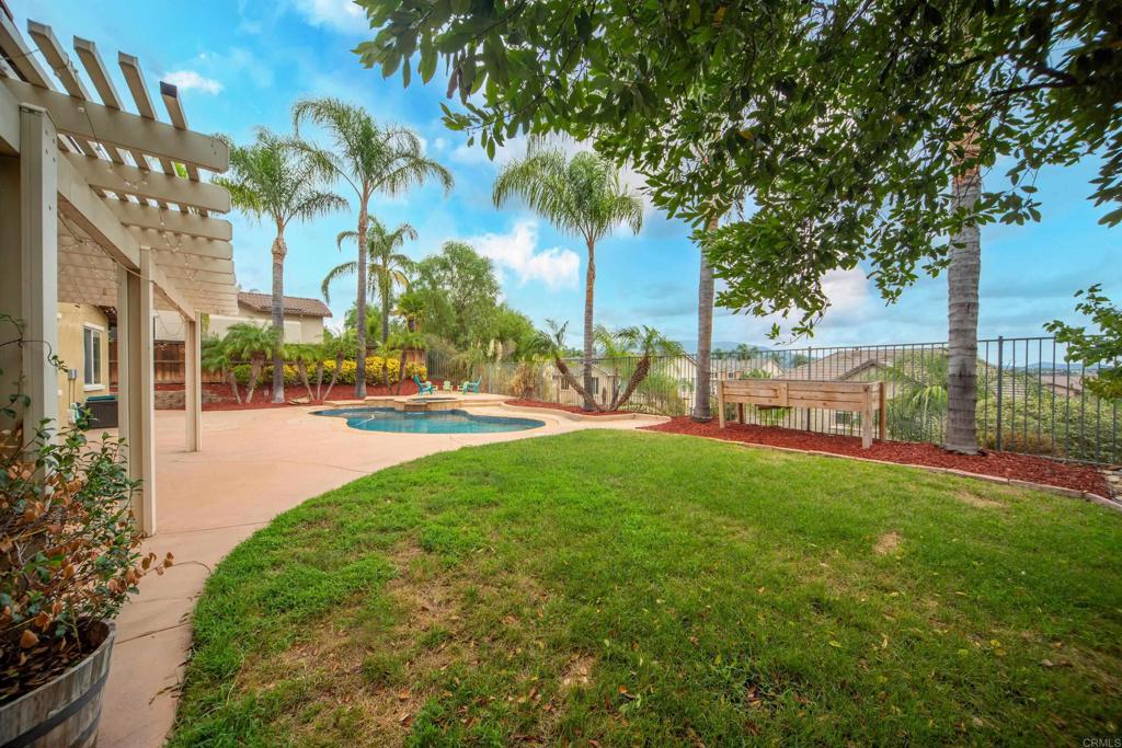 32215 Vía Bejarano Temecula, CA 92592 - Photo 24 of 42 a view of yard with swimming pool and green space