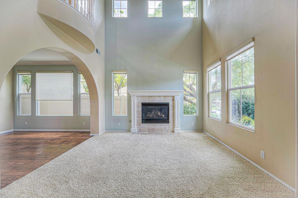 32215 Vía Bejarano Temecula, CA 92592 - Photo 28 of 42 an empty room with windows and fireplace