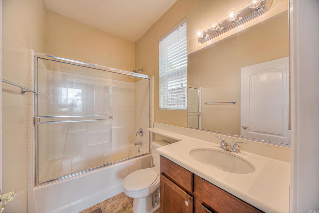 32215 Vía Bejarano Temecula, CA 92592 - Photo 39 of 42 a bathroom with a sink and a mirror
